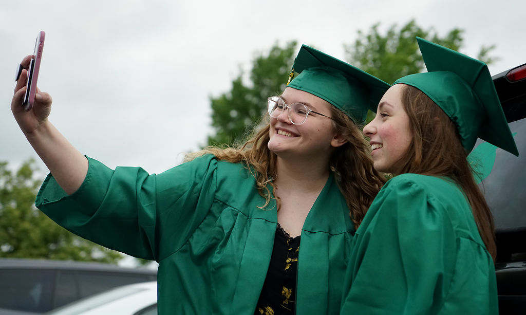 Maddie Renner takes a selfie with Ava Gorham before the start of the Rock Bridge High School